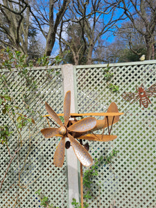 Wind propelled plane garden sculpture